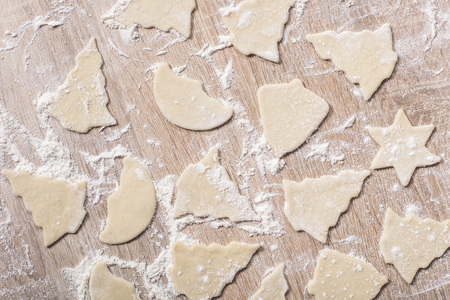 food background, raw christmas cookies closeup on tableの写真素材