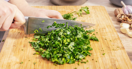 cook chopped parsley on wooden board closeup