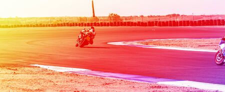 competition, motorcycle racer rides on a sports trackの写真素材
