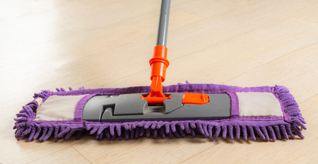 mop with a rag close-up on light linoleum