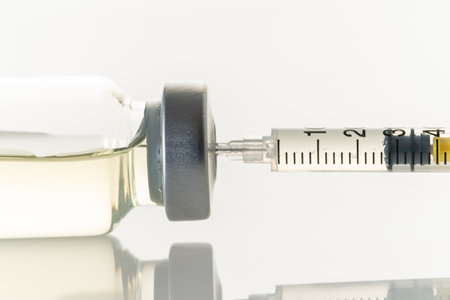 syringe and medicine bottle on white backgroundの写真素材