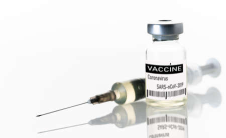 syringe and medicine bottle on white backgroundの写真素材