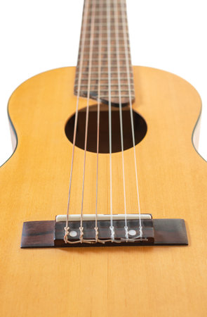 wooden guitar six-string closeup on white background