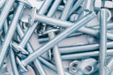 background of new bolts and nuts close-up
