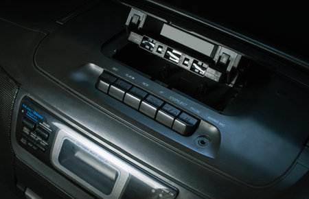 audio tape recorder closeup on black background