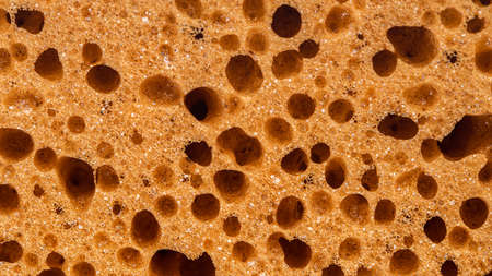 background from texture of beige sponge closeupの写真素材
