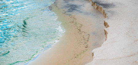 natural background, sandy shore and water closeupの写真素材