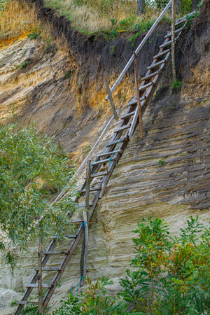 cliff with wooden old stairs closeup, landscapeの写真素材