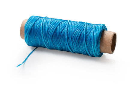 spool of sewing thread close up on white backgroundの写真素材