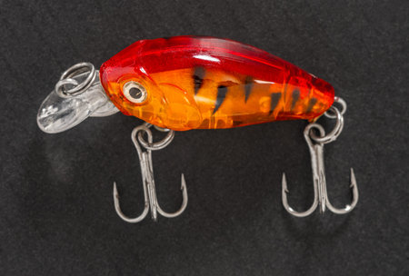 Fishing tackle, wobbler close-up on a black background