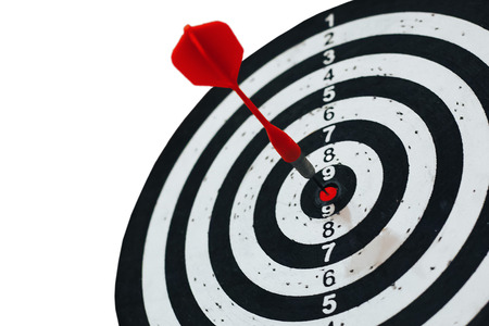 Darts game with a dart in the target center isolated on white backgroundの写真素材