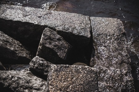 A photo of hole in the crack cement concrete wall surface texture, the conceptual background, closeupの写真素材