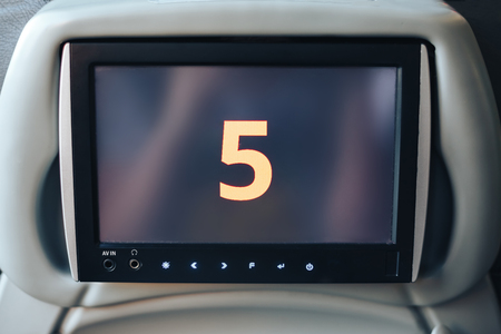 Long-distance international bus of the raised comfort with built in seat chair, a TV or a tablet where they can watch movies during road and listen to music, surf the Internetの写真素材