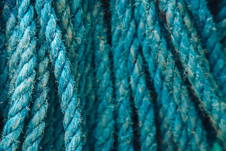 Background texture of coiled marine or nautical rope.Texture of synthethic mooring line. Close upの写真素材