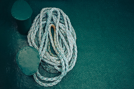 Background texture of coiled marine or nautical rope.Texture of synthethic mooring line. Close upの写真素材