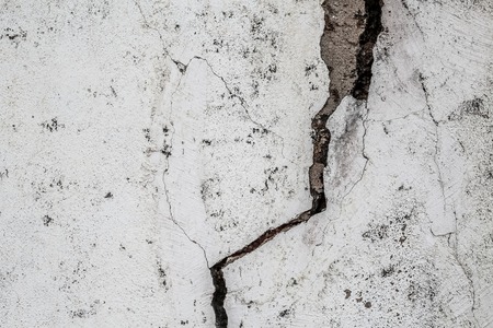 Grunge concrete cement wall with crack in industrial building, great for your design and texture backgroundの写真素材