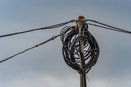 Tangle of Electrical Wires on Power Poleの写真素材