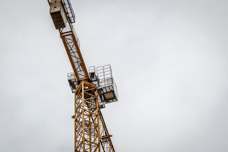 Construction site with cranes on sky backgroundの写真素材