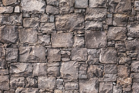 pattern gray color of modern style design decorative uneven cracked real stone wall surface with cementの写真素材