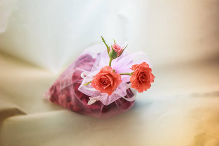 Orange roses in pink bags.の写真素材