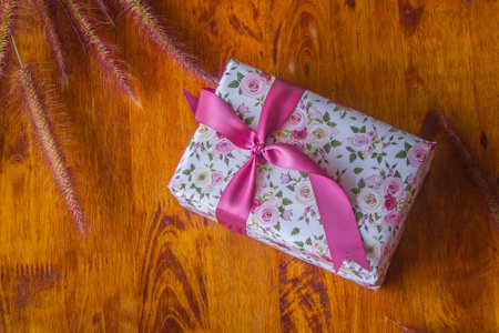 A handful of gift boxes are empty on a wooden floor. Love is a gift for someone special.の写真素材