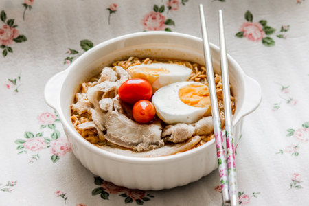 Pork, egg noodles flavored with tomatoes.の写真素材