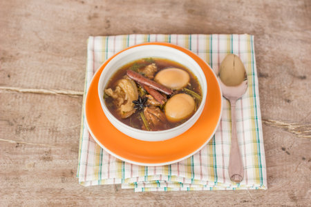 Foods that consist of pork and eggs are sweet on wooden boards.の写真素材