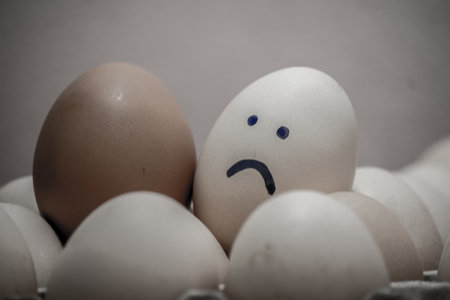 A number of eggs are filled with a pen with a facial expression.の写真素材