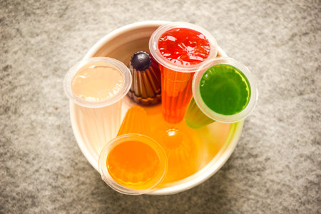 Pearly colored fruit flavored pudding is placed in the cup.の写真素材