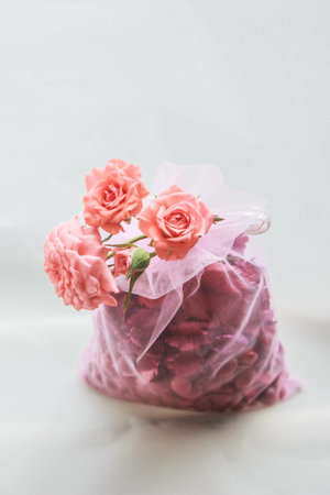 Orange roses in pink bags.の写真素材