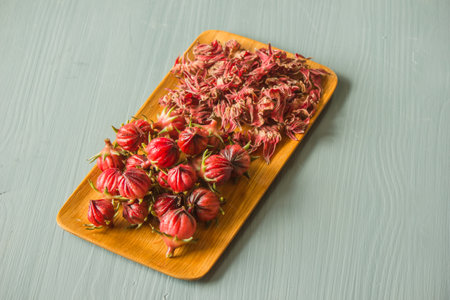 Fresh and dried roselle in a pan prepared to cook for a drink.の写真素材