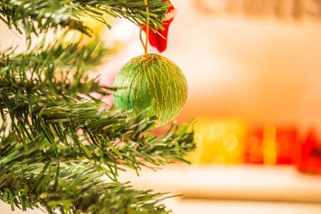 Christmas tree decorated with red balls bell.の写真素材