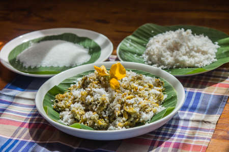Sesbania flower is a dessert that is mixed with rice flour and then steamed. When cooked, bring the crunchy coconut, salt, sugar to mix and eat.の写真素材