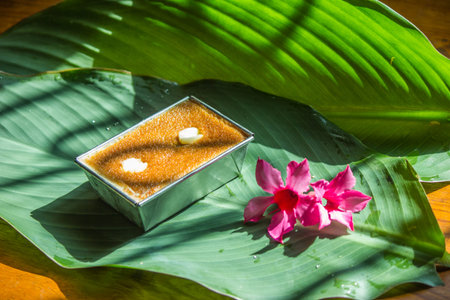 Delicious, sweet, and famous Thai desserts in Phetchaburi are placed on the leaves to make them look...