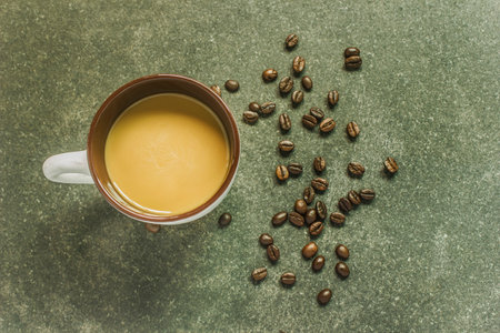 coffee cup and coffee beans on black backgroundの写真素材