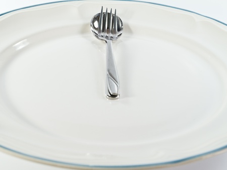 Spoon and Fork as Clock at Lunch Timeの写真素材