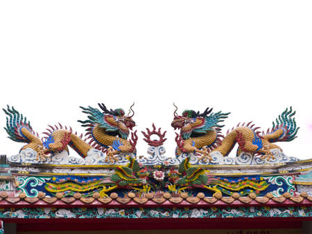 Dragon statue on temple roofの写真素材