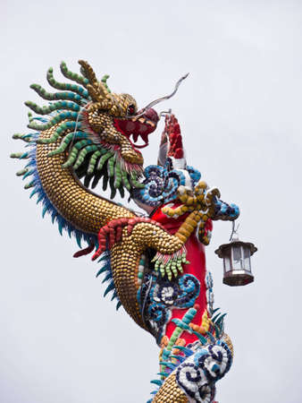 Dragon statue on the post in templeの写真素材