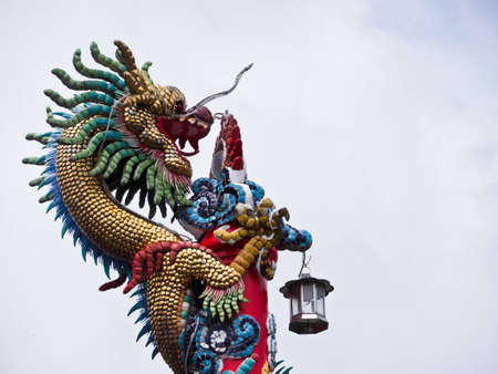 Dragon statue on the post in Buddhist templeの写真素材