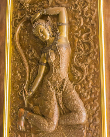 Angel statue, art on Buddhist temple door