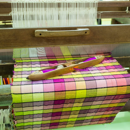 Weaving traditional Thai cloths with local apparatus