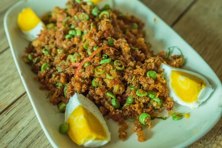 Crispy catfish salad with cut boiled eggの写真素材