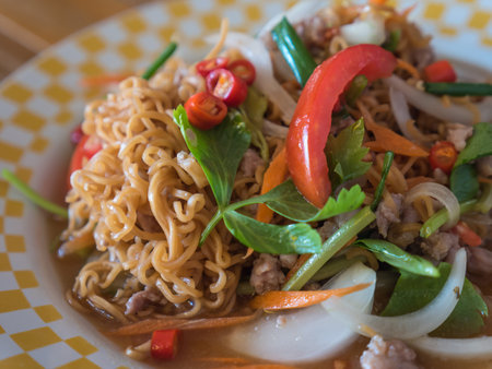 Yellow noodle spicy salad with mixed vegetablesの写真素材