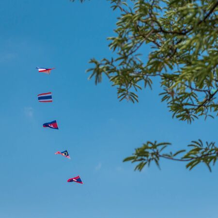 International Asian flags kite on skyの写真素材