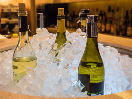 Bottles of wine in ice bucketの写真素材