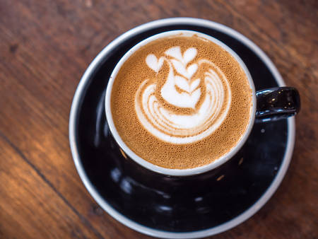 Pattern art on hot coffee in mugの写真素材