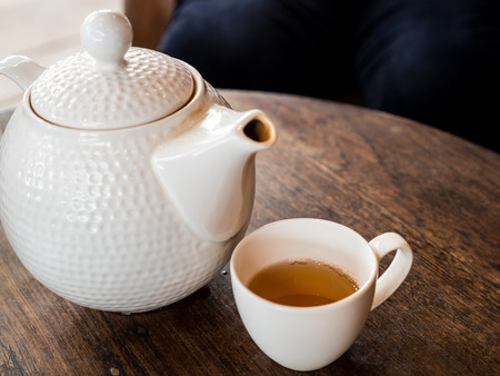 Hot tea in mug and potの写真素材