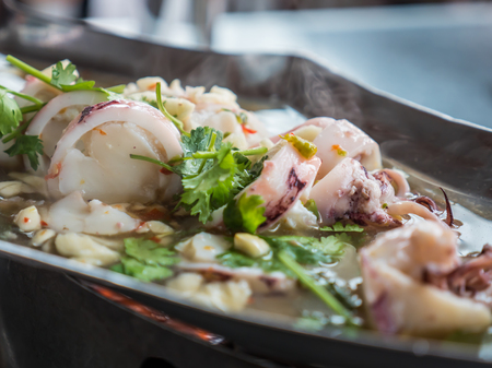 Hot spicy squid in sour soupの写真素材