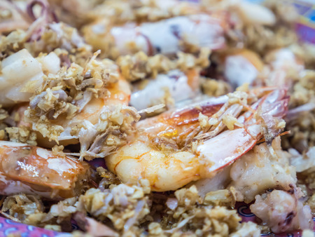 Fried prawn and squid with crispy garlicの写真素材