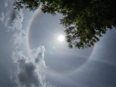 Sun halo on blue sky background, natural phenomenon